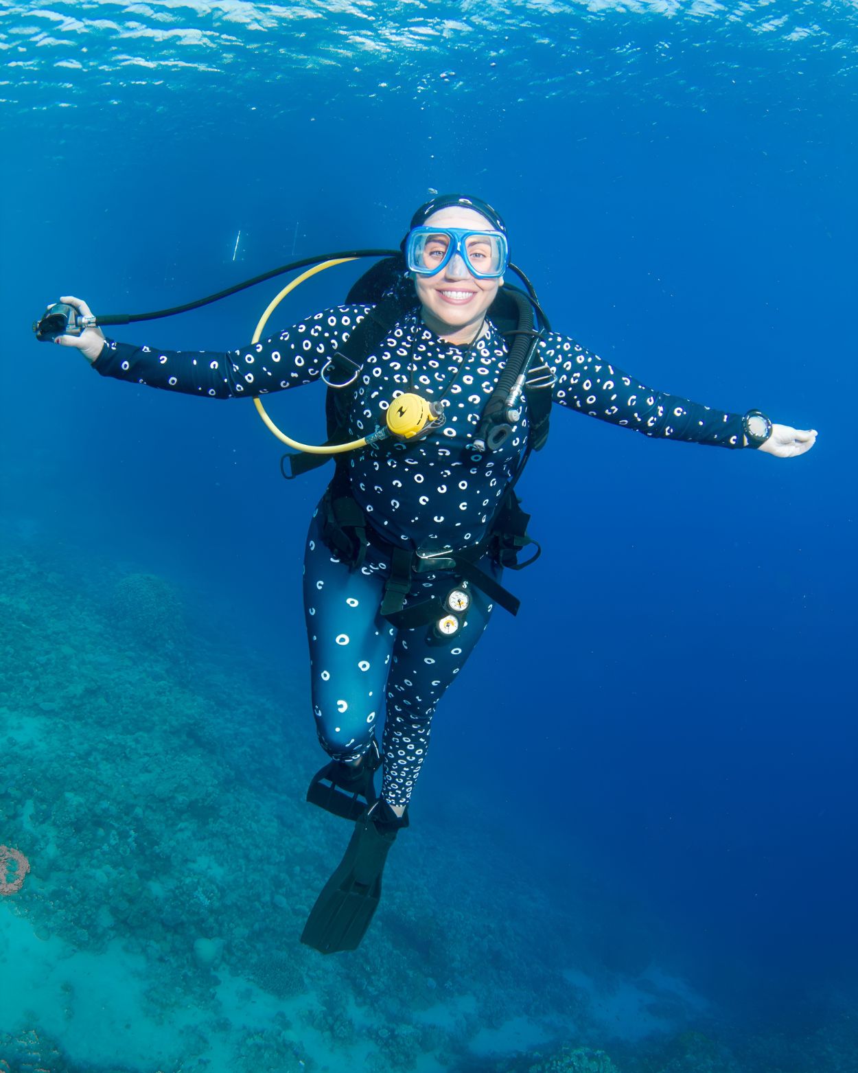 scuba diver in spotted eagle ray dive skin